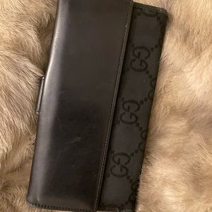 Vintage authentic black Gucci wallet with check book slot. Excellent condition